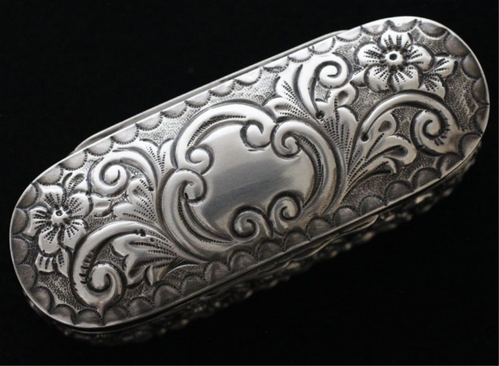 William Aitken Edwardian Silver & Gilt Box: Est $ 30 - 50 William Aitken Edwardian Silver & Gilt Box • made by William Aitken of Birmingham, England in 1903-1904 • bears the marks: (lion passant), (anchor), W · A, d • 3 3/8" in length an