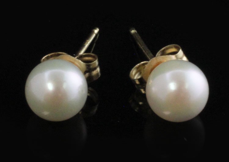 Cultured Pearl Stud Earrings in Yellow Gold: Est. $50 - 100 Cultured Pearl Stud Earrings in Yellow Gold. 14k yellow gold weighs approx. .78 grams. Pearls (2) 5.80mm round white. Good luster. Very minor blemishing. Green hue.