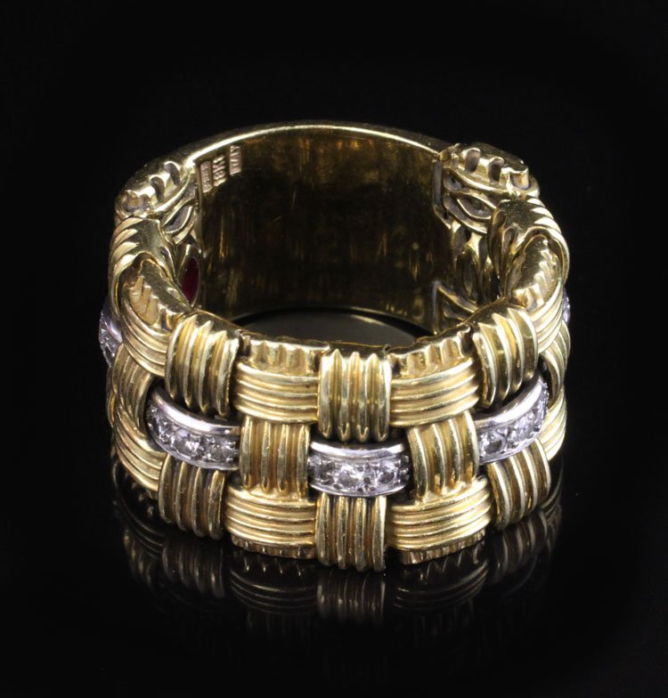 Roberto Coin Appassionata 18k Ring with Diamonds: Roberto Coin Appassionata ring with three rows of 18k yellow gold woven together and the signature ruby on the inside. It is adorned with (12) Diamonds with a .25 ctw. It is a size 8 and is approx 14