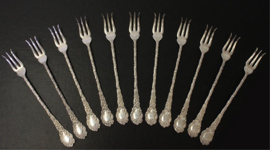 11 Wallace Silver Louvre Pattern Oyster Forks: Est $ 120-180 11 Wallace Silver Louvre Pattern Oyster Forks made by R. Wallace & Sons Mfg. Co. of Wallingford, CT and was designed in 1893 bears the marks: (stag), RW&S, STERLING 5 5/8" in length and 
