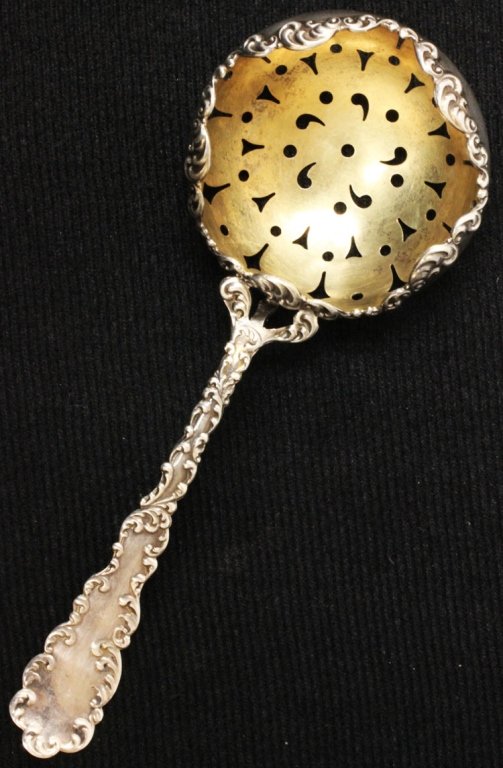 Wallace Silver and Gilt Waverly Tea Strainer: Est $ 25-35 Wallace Silver and Gilt Waverly Tea Strainer made by R. Wallace & Sons Mfg. Co. of Wallingford, CT and was designed in 1890 bears the marks: (stag) RW&S, STERLING 5 1/2" long and weighs .9