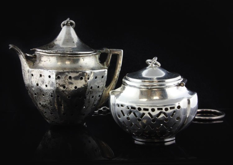 2 Webster Silver Figural Tea Balls: Est $ 25-35 2 Webster Silver Figural Tea Balls made by Webster Company of North Attleboro, MA circa 1920 bears the marks: W Co (intersected by arrow) 2 1/8" in height (larger one) and weighs 0.835 tro