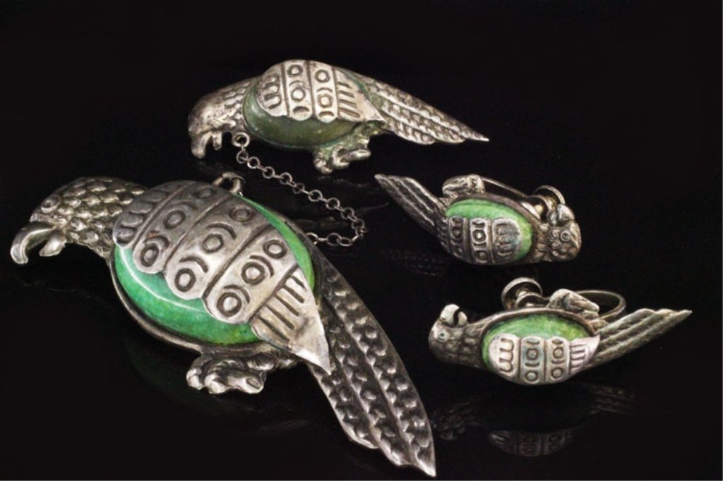 Vintage Brooch & Earring Set in Sterling: Est. $90 - 150 Vintage Brooch & Earring Set in Sterling. 27.7 grams total weight. Gemstones appear to be green chalcedony oval cabachons. Each piece is a bird design. Birds in brooch are 2 3/4 and 1 3