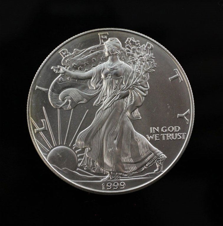 1999 US One Dollar $1 Silver Eagle: Est. $50 - 75 1999 US One Dollar $1 Silver Eagle. Very nice condition.