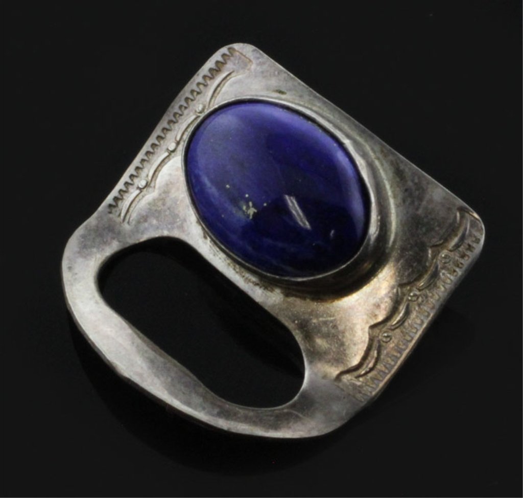 Lapis Brooch in Sterling: Est. $30 - 70 Lapis Brooch in Sterling . 4.6 grams total weight. Gemstone lapis, oval polished. 10 X 14mm. 7/8 X 7/8 inch overall dimensions. May be designed to hold reading glasses.