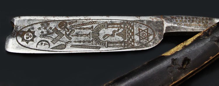 Masonic Wade & Butcher Sheffield Straight Razor: Est. $200 - 300 Masonic Wade & Butcher Sheffield Straight Razor. Vintage masonic straight edge. Handle is in poor condition. Blade is adorned with numerous Masonic symbols.