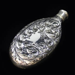 Derby Repousse Flask: Est. $ 50 - 80. Marked Derby Silver Co. 045. Measures 5.75" long. Weighs 4.340 ozt.