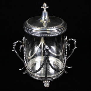 Vintage Italian Biscuit Jar: Est. $ 150-225 Vintage Italian Biscuit Jar Israel Freeman and Sons, marked made in Italy glass and silver jar. Has two silver handles with silver attached lid. 10" tall and 7" wide. Weighs 33.76 troy