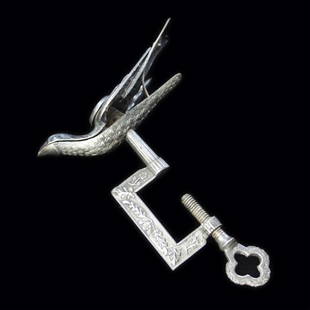 Vintage Sewing Clamp: Est. $ 40-75 Vintage Sewing Clamp Silver plated Bird Clamp, marked patented Feb 15, 1856, has a floral design, the bird is 3 1/2" wide and with the clamp tightened it is 4 1/2" long. Weighs 1.98 troy