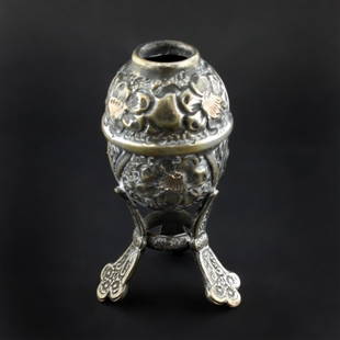 Silver Egg Shaped Container: Est. $ 15-25 Silver Egg Shaped Container Late Qing Dynasty Egg on Three feet with geometric and floral decoration inlayed with gold floral centers. Single Character Chinese mark on the base in Kaishu