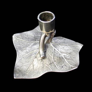 Whiting Figural Leaf Candle Holder: Est. $ 50 - 80 Whiting Figural Leaf Candle Holder Fine detail on leaf. Marked W, Lion, Sterling 1753. Measures 2.5" wide and 1.5 inches tall. Weighs 1.31 ozt.