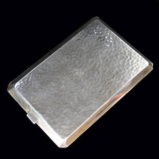 Sterling Cigarette Case: Est. $ 140-225 Sterling Cigarette Case Vermeil inside and hand hammered exterior, marked sterling 4 1/2" x 3 1/8" x 1/4" and weighs 4.51 ozt