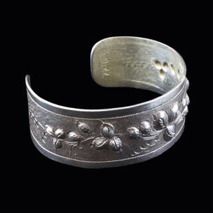 Chased Sterling Cuff Bracelet: Est. $ 30-45 Chased Sterling Cuff Bracelet Marked Chase sterling, E. Duodale has a berry design. 2 1/2" long, 2" wide and has a 1 1/2" opening. Weighs 1 .18 troy oz