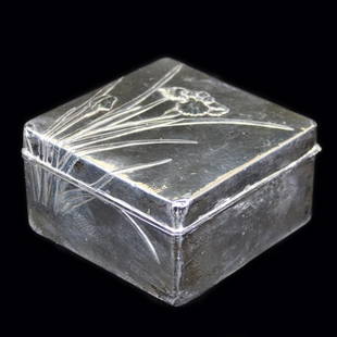 Sterling Covered Box: Est. $ 75-125 Sterling Covered Box Low relief floral design or an Iris flower, interior lined with wood, the top is hinged, has an impressed "sterling" marks. Several dints noted 1 5/8" x 3" x 3"