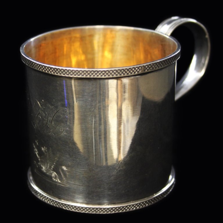William Thomson Small Cup: Est. $ 100 - 140 William Thomson Small Cup Coin silver mug with threat handle. Early 1800's. Monogrammed LEH with a Griffon family crest. Gilt inside of cup. Marked W. Thomson. Measures 2.75" tall and
