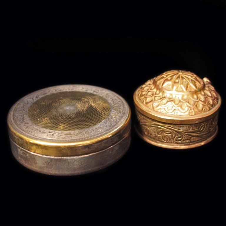 Silver and Brass Boxes: Est. $ 30-45 Silver and Brass Boxes First box is Silver and Vermeil round covered box made by Venterlla Rona, lid has a geometric an floral decoration circa 1900. The second box appears to be brass an