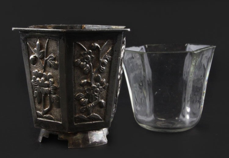 Vintage Salt Cellar: Est. $ 30-45 Vintage Salt Cellar Hexagonal Chinese export footed vermeil interior container with glass liner. External Repousse floral design, glass has several chips from circa late Qing dynasty. 1 1