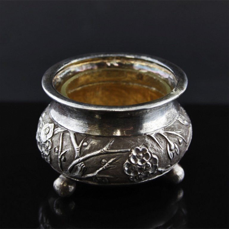 Chinese Export Salt Cellar: Est. $ 40 - 70 Chinese Export Salt Cellar Vermeil interior with a glass liner, repousse floral décor on the exterier, makers mark is WC 90 and was believed to be made during the late Qing Dynasty. 1 