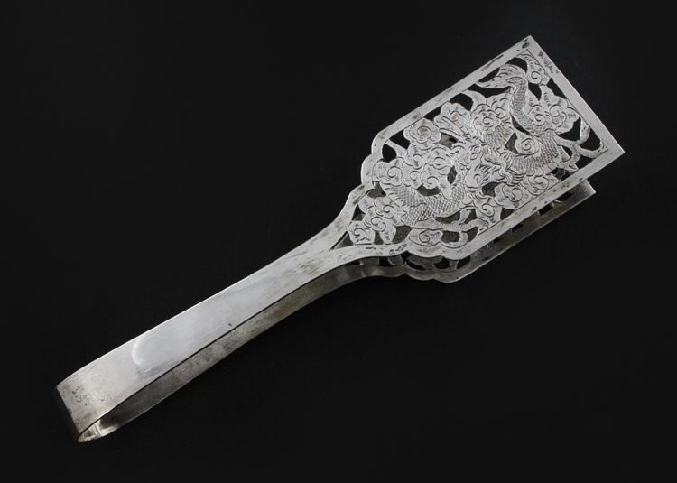 Reticulated Silver Tongs: Est. $ 75-120 Reticulated Silver Tongs Chinese exported silver tongs, 3 clawed dragon among cloud motif. 2 character unreadable Chinese mark Kaishu script, made during the late Qing dynasty Chinese ex