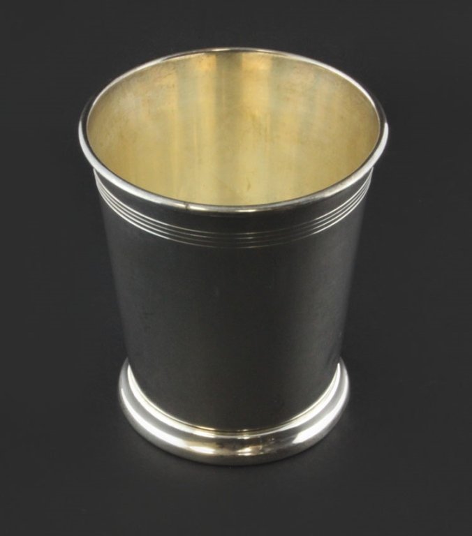 Reed and Barton Mint Juilip Cup: Est. $ 110-165 Reed and Barton Mint Julep Cup Measures 3.75" tall and 3" across. Marked Reed and Barton, Sterling, H14. Weighs 3.325 ozt.
