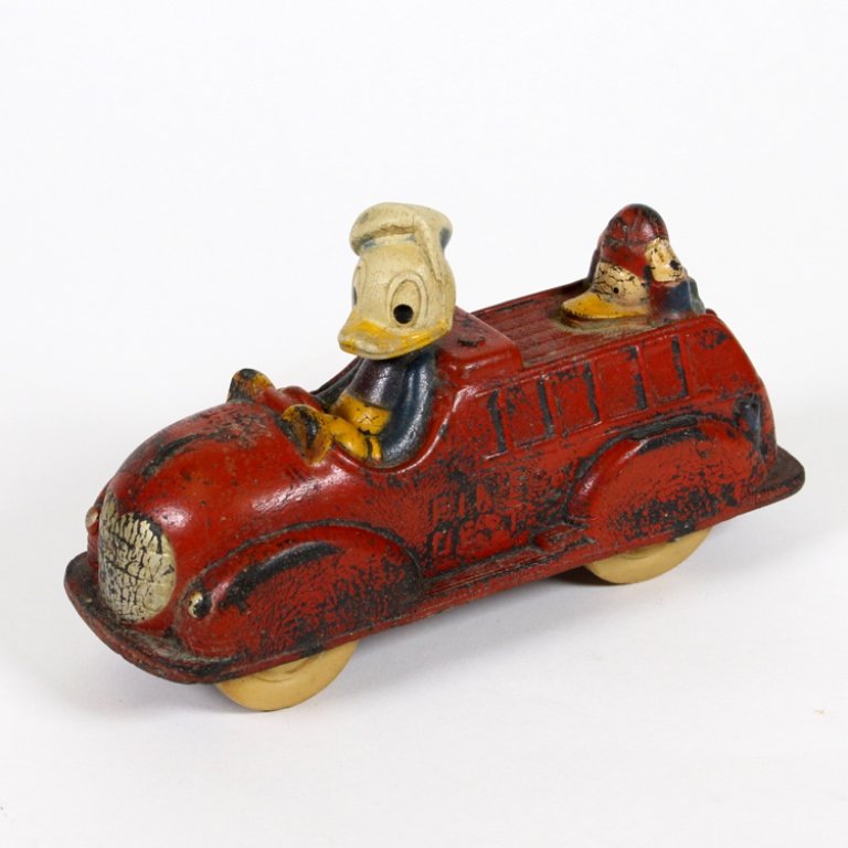 Vintage Donald Duck Fire Engine: Est. $ 40-75 Vintage Donald Duck Fire Engine Rubber body and tires. Walt Disney product. Made by The Sun Rubber Co. Condition issues include crazing, cracking and loss of paint. Fire engine theme with