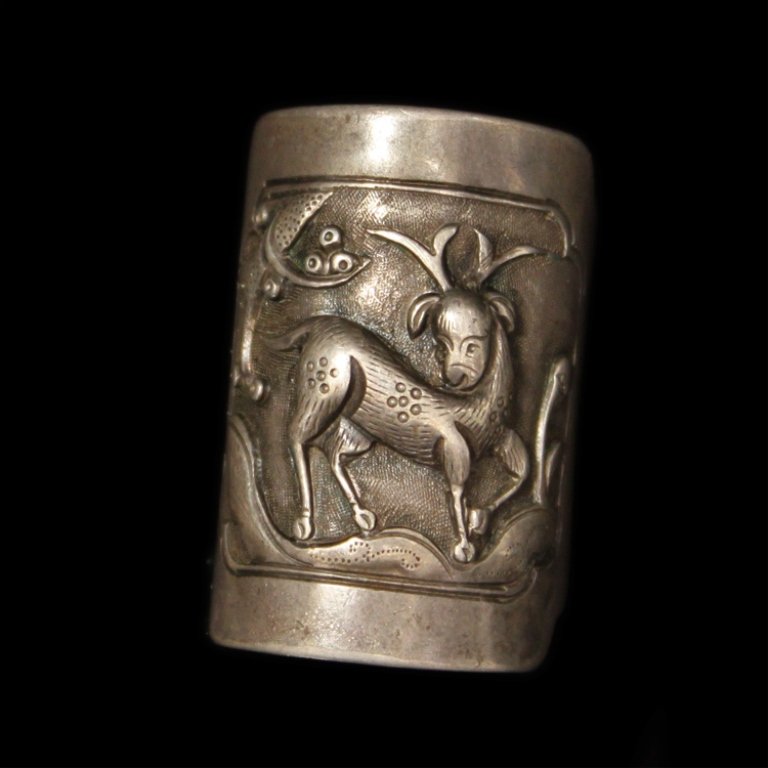 Chinese Silver Ring with Embossed Animal Scene: Est. $ 175-350 Chinese Silver Ring with Embossed Animal Scene 5.96 grams total weight. Ring is 1 1/8" at widest point. Embossed design of a deer in nature with hand tooled accents.
