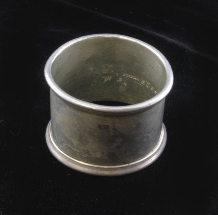 Gorham Sterling Napkin Ring: Est. $ 45-80 Gorham Sterling Napkin Ring Late 19th century. Meausres 1.25 x 2". Weighs 1.360 ozt. Marked Gorham, Lion, Anchor, G, Sterling, W10.