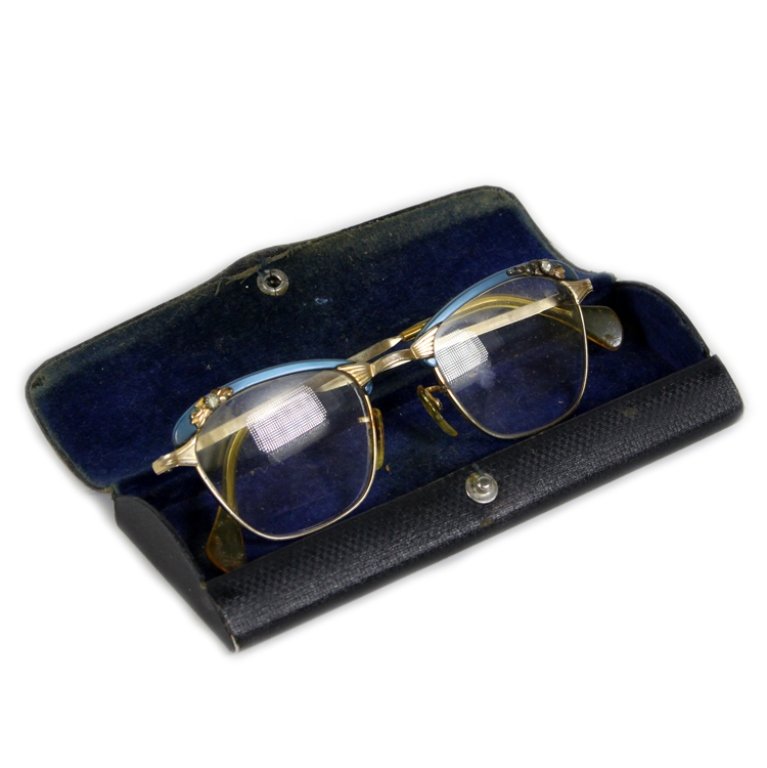 Vintage Pair of Cats Eye Ladies Glasses: Est. $ 20-40 Vintage Pair of Cats Eye Ladies Glasses. American optical brand ladies glasses in classic cats eye style. 12k gold filled with blue composite upper frame and accent with rhinestones. Come