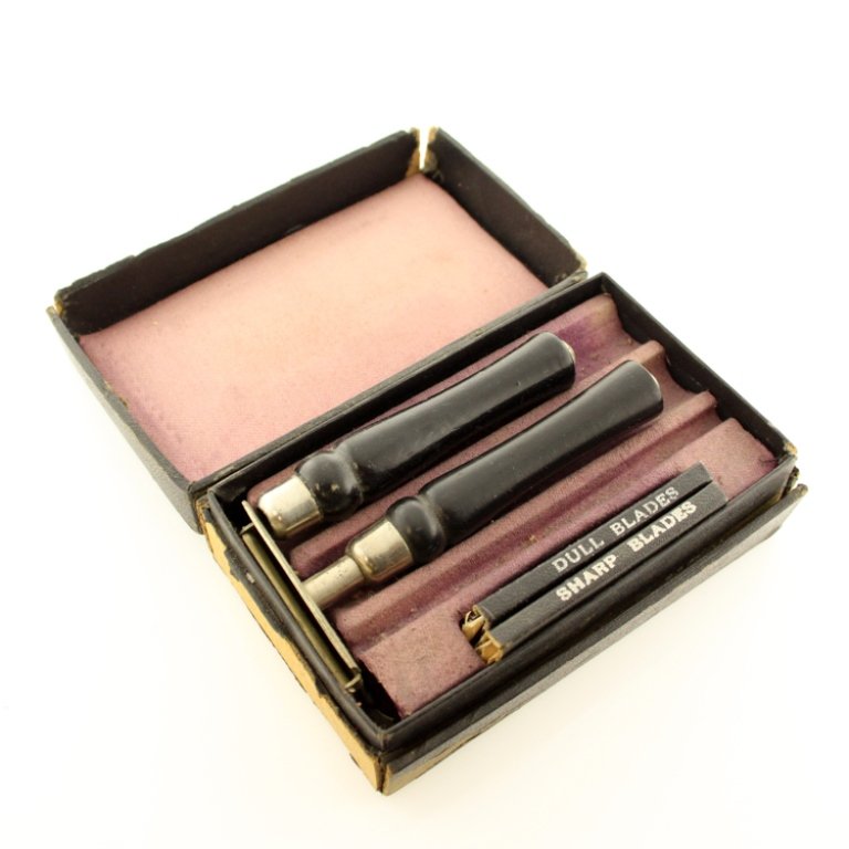 Crescent Mfg The Mitch Razor: Est. $ 30 - 50 Crescent Mfg The Mitch Razor Ten Blade safety razor. Original box with loss to where the name is and on the edges of box. Has one razor head, two handles, and two cases for dull and sha