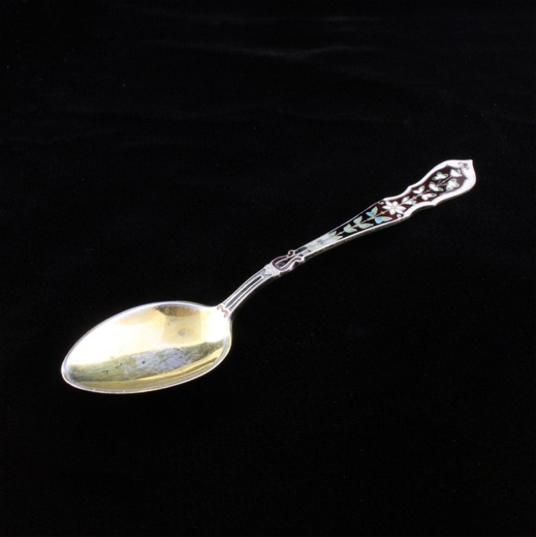 Enamel Painted Gorham Demitasse: Est. $ 20 - 35 Enamel Painted Gorham Demitasse. Worn vermeil and enamel decorated spoon, enamel is of floral and a geometric design on the front of the handle. On the reverse has the Gorham makers mar