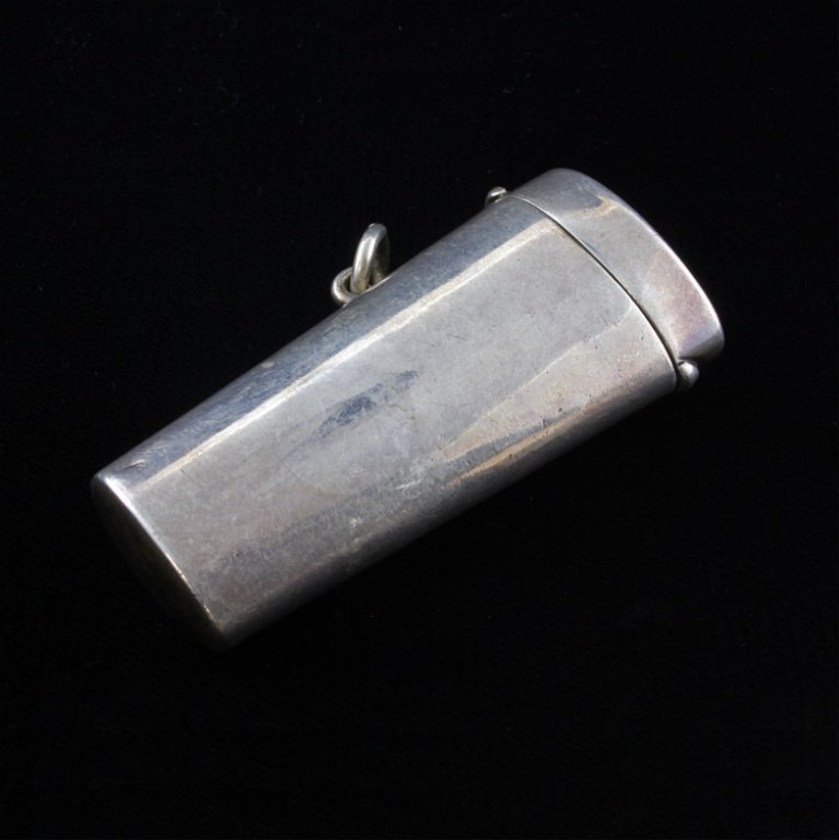 Henry Wilkinson & Co. Ltd. Lighter Case: Est $ 25-50 Sterling Lighter Case with a decorated Bee etched on the side by Henry Wilkinson & Co Ltd. The case has a sterling attachment loop and has a few minor condition issues such as minor discol