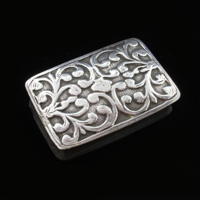 Unite & Hilliard Vinaigrette: Est $ 50-85 Sterling Vinaigrette made by George Unite and James Hilliard with Birmingham marks. The grill is a guilt and pierced floral scrolled design, the exterior has a floral relief ornamentation 