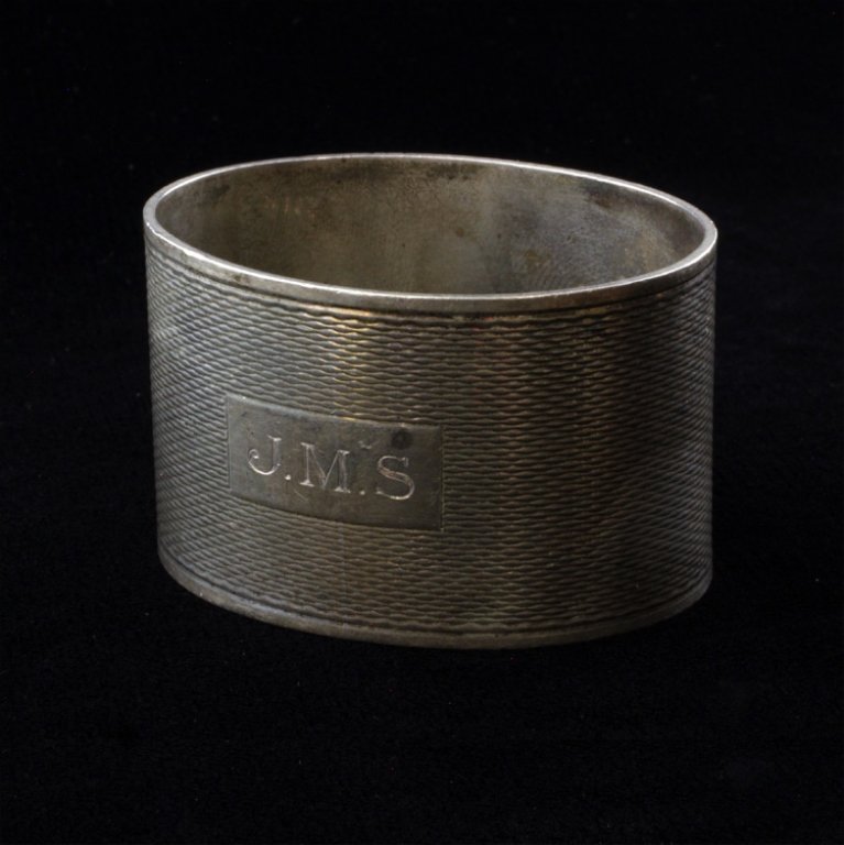 S J Rose & Son Napkin Ring: Est $ 60-95 Sterling Oval Napkin Ring with a geometric decoration and a light vermeil exterior. The napkin ring made by S J Rose & Son is monogrammed J.M.S in a rectangular design. The oval ring is ma