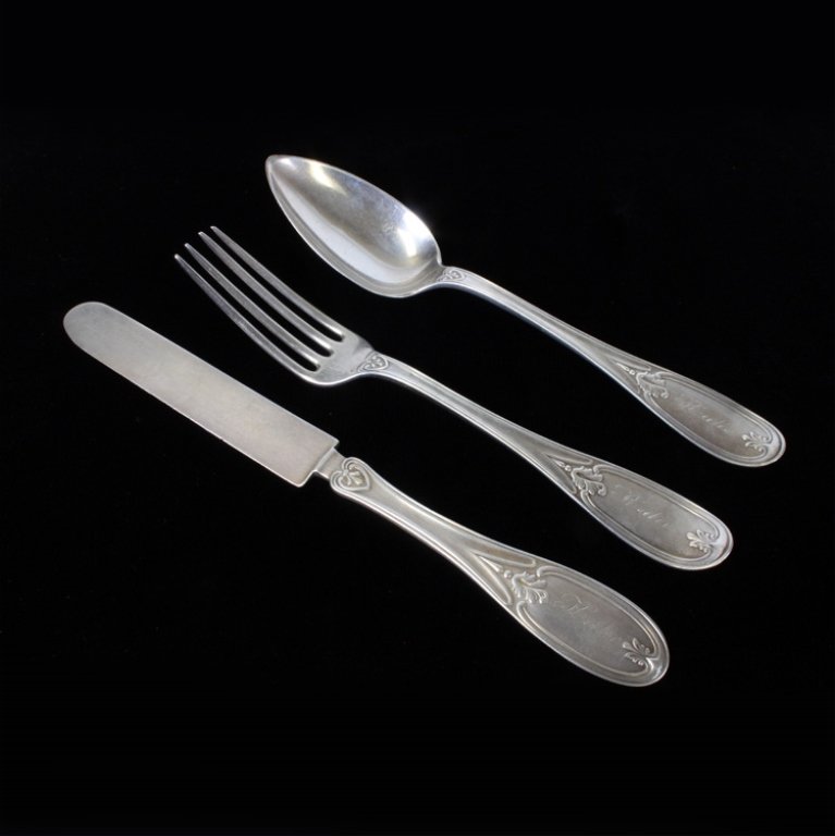 Woods & Hughes Tuscan Silverware Set: Est $ 80-110 Sterling silver set Tuscan pattern of 1846. The set includes a knife, fork and spoon each engraved Katie on the handle. The reverse of the handles are marked with the W&H of Woods & Hughe