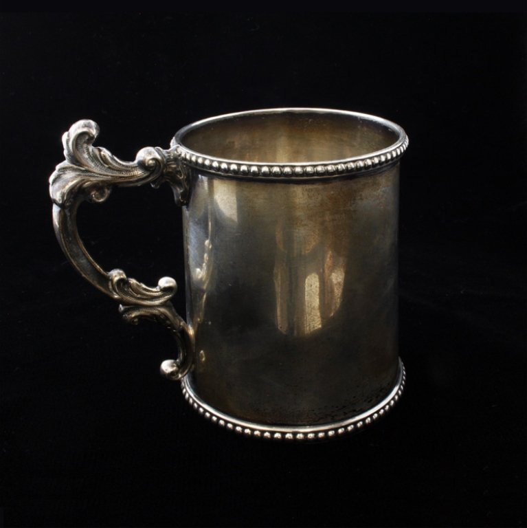 Taylor & Lawrie Child Mug: Est $ 90-130 Child/Christening Mug, engraved Joseph Warner Russell, 1856. Marked Taylor & Lawrie with the makers marks. The mug has a beaded border on the top and bottom and also has minor discolorati
