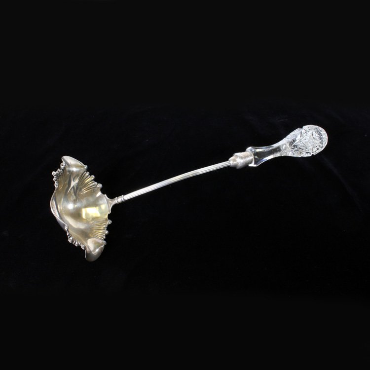 15 1/2" American Brilliant Cut Glass Punch Ladle: Est $ 100-500 Pairpoint Brilliant Cut Glass & Silver Plate Punch Ladle. Cut glass handle, silver plate shaft and bowl. Marked Pairpoint Mfg. Co. with a Hobstar, Strawberry Diamond and Fan Motif. On th