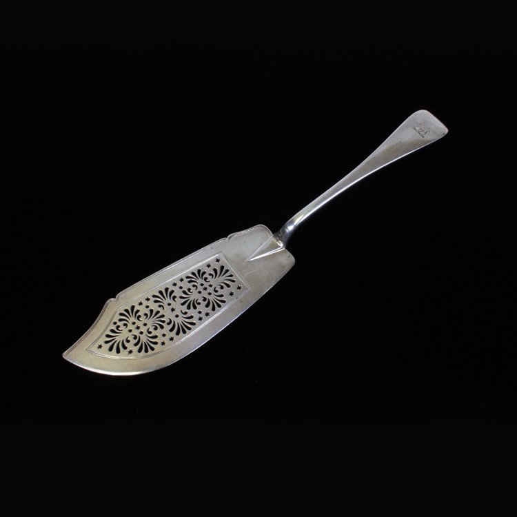 George William Adams Fish Server: Est $ 200-300 Pierced sterling fish server made by George William Adams with an 1859 date mark. The server has an etched lion on the end of the handle, the pierced design on the blade includes stars,