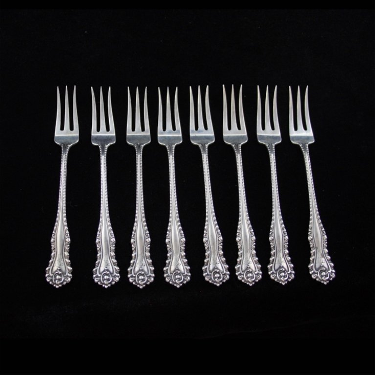 Dominick & Haff Mazarin Oyster/Cocktail Forks: Est $ 100-200 Set of 8 oyster/ cocktail forks made by Dominick and Haff with the 1892 Mazarin pattern designed by Gilbert L. Crowell, Jr. The forks have a personal monogram that appears to be an EW on