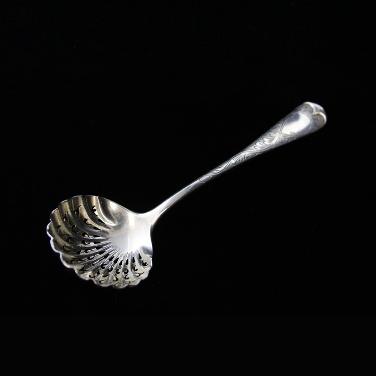 Robert Stebbings Sugar Sifter Spoon: Est $ 60-120 Sterling sugar sifter spoon made and marked by Robert Stebbings. The spoon has a shell shaped and pierced bowl with an etched with a scroll work design. The reverse of the handle bears th