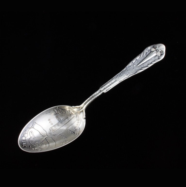 Mauser Gorham Sterling Birth Record Baby Spoon: Est $ 70-130 Sterling souvenir birth record baby spoon, the handle is a figural stork from the front and his back at the reverse. The bowl depicts a baby wrapped in a ribbon hanging from a scale with 