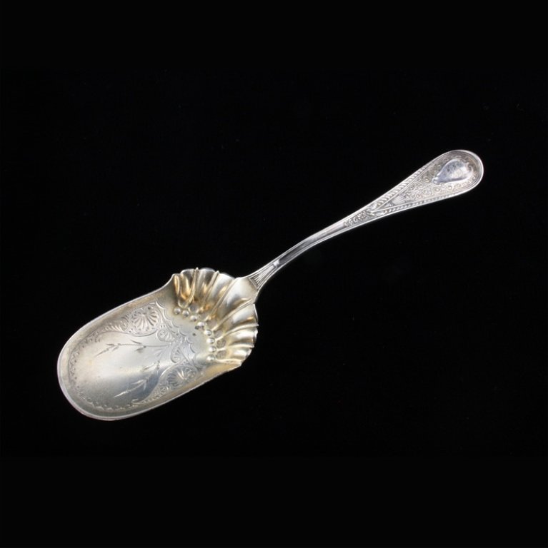 Gorham Hindostanee Sugar Spoon: Est $ 70-120 Sugar spoon made by and marked by Gorham with the 1878 Hindostanee pattern designed by George Wilkinson. The is monogrammed F.G.S. the reverse of the handle is marked sterling, Gorham and