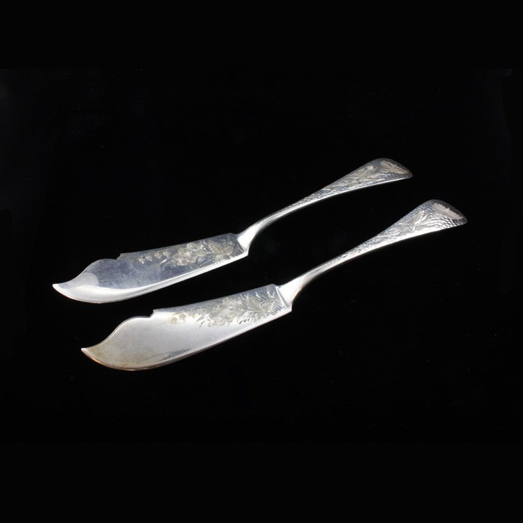 Set of Bailey Banks & Biddle Master Butter Knife: Est $ 150-300 Set of two sterling master butter knives made and marked by Bailey, Banks & Biddle designed a bright cut etch floral design and the handle has a hammered finish. The butter knives are ma