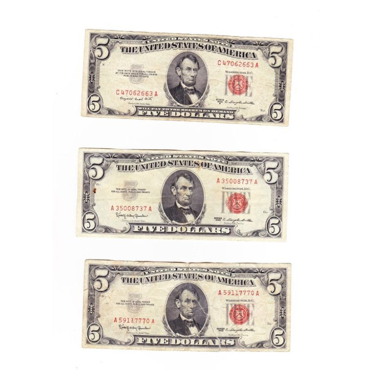 Lot of 3 Red Seal 5 Dollar Bills: Est. $ 30 - 50 Lot of 3 Red Seal 5 Dollar Bills. Circulated. One 1953. Two 1963. One has been taped on a tear.