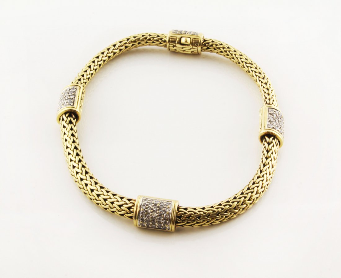 John Hardy 18k Classic Chain & Pave Diamond Bracelet: Est. $3000-4000. John Hardy 18k Classic Chain & Pave Diamond Bracelet. 18k yellow gold, weight is 31.19 gr. Bracelet is 4.75mm wide and 7.625" long. Four pave stations. Diamonds 0.50 TW approximate. F