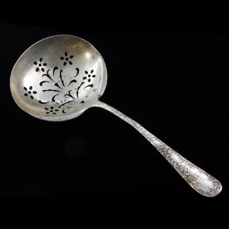 Gorham Douglas Pierced Bon Bon Spoon: Est $ 100-140 Sterling bon bon spoon made by Gorham with the 1899 Douglas pattern. The handle is monogrammed with the letter A and the bowl is pierced with a floral pattern. The reverse of the handle 
