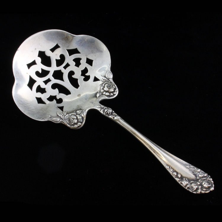 Sterling Wallace Rose Bon Bon Spoon: Est $ 80-140 Sterling bon bon spoon made by Wallace with the1888 Rose pattern designed by Henry L. Wallace. The reverse of the handle is marked sterling, Pat. 1898 an RW&S makers mark. The spoon measu