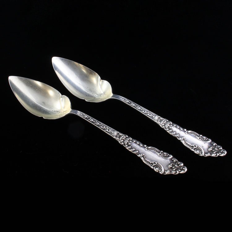 Set of Two Fruit Spoons Baker-Manchester: Est $ 70-120 Set of two sterling orange/ fruit spoon made by Baker-Manchester with the1898 Lafayette pattern designed by Ernest W. Campbell. The reverse of the handle is marked Sterling and bears the 