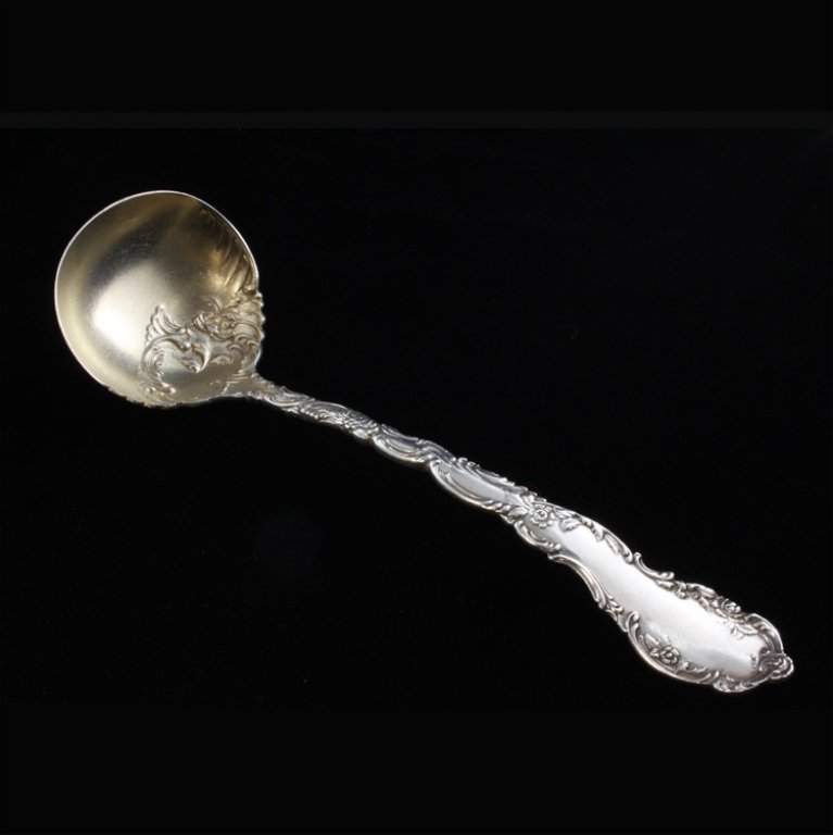 Wendell Mfg. Co. Sterling & Gilt Ladle: Est $ 70-120 Sterling and gilt gravy ladle made by Wendell Mfg. Co. with the1896 Junior Rococo pattern designed by Mauser. The ladle is marked sterling and bears the Wendell Mfg. Co. W and lions maker