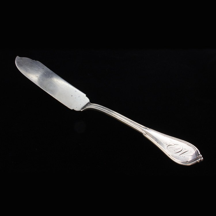 Sterling Gorham Cottage Master Butter Knife: Est $ 90-120 Sterling master butter knife made by Gorham with the 1861 Cottage pattern designed by John Gorham, Lewis Dexter, Jr. and Gorham Thurber. The handle is monogrammed with EW, the reverse is 