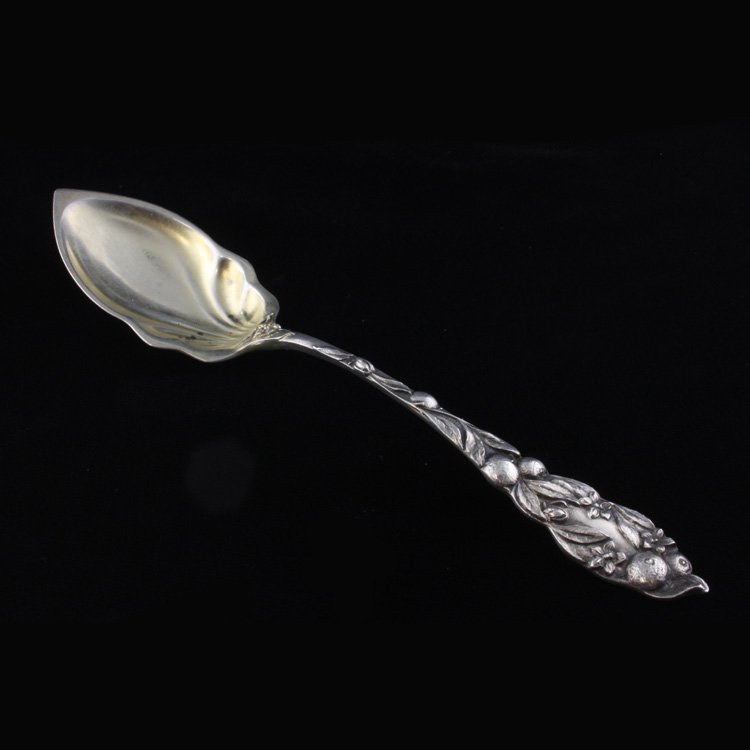 The Watson Co. Orange Fruit Spoon: Est $ 60-100 Sterling and gilt fruit/ orange spoon made by The Watson Co. with the1903 Fruit Series No. 1 orange pattern designed by Eustace Crees & Charles S. Court. The spoon is engraved Harriett, s